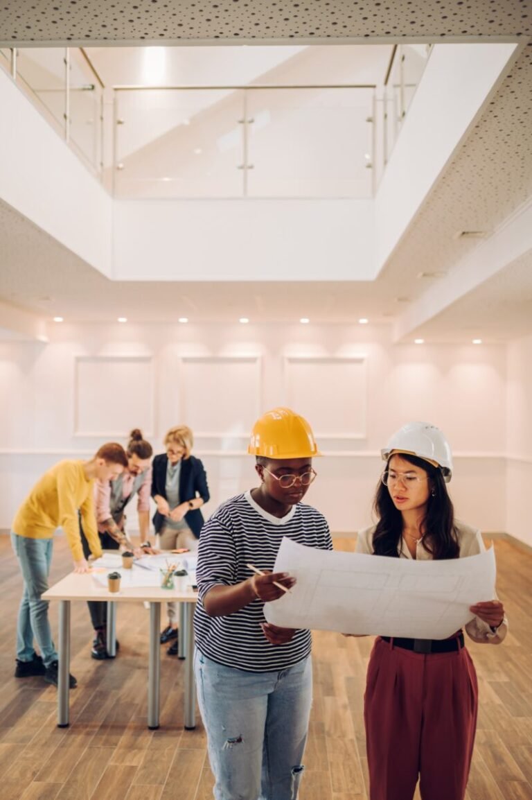 Citadel DBD architects, engineers, and construction professionals reviewing project plans during a design-build planning meeting